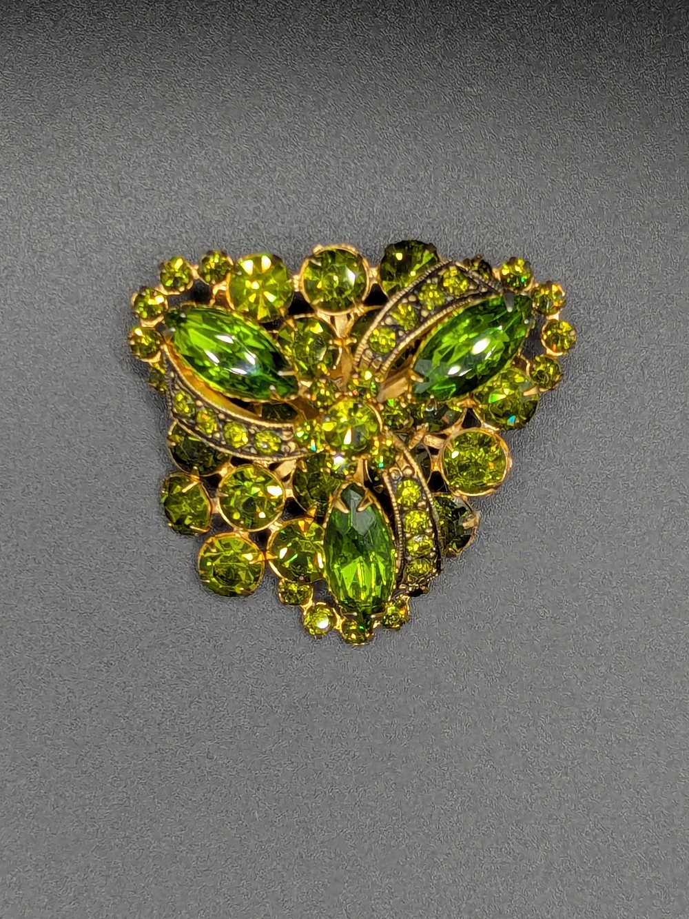 Vintage Austrian green rhinestone brooch
